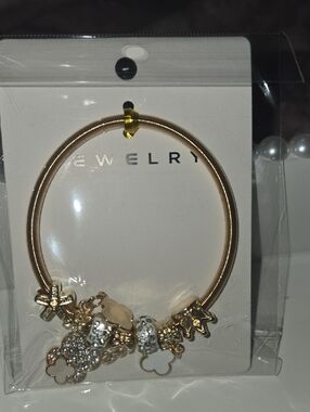 Gold Charm Bangle Bracelet with Floral and Crystal Accents